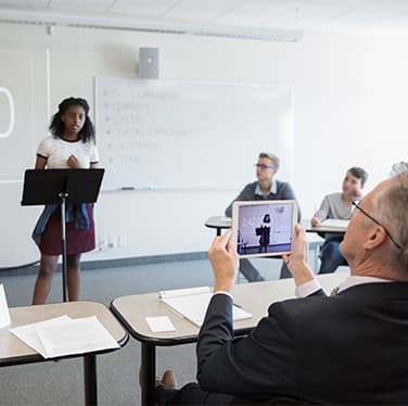 Teacher recording student in debate class