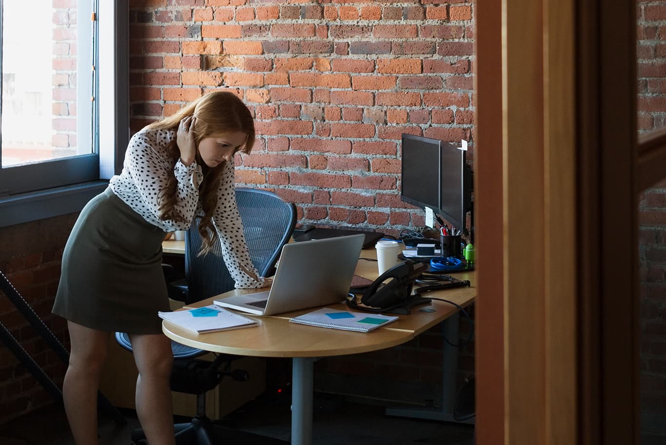 woman using computer in office