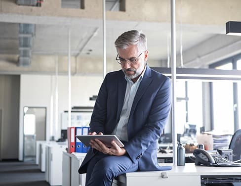 man looking at tablet