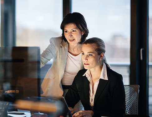 women looking at computer