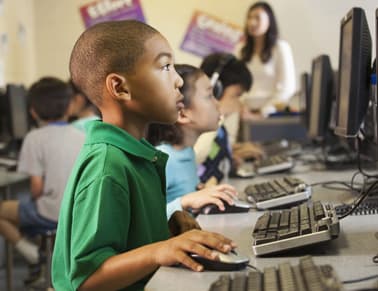 kids and teacher in computer lab