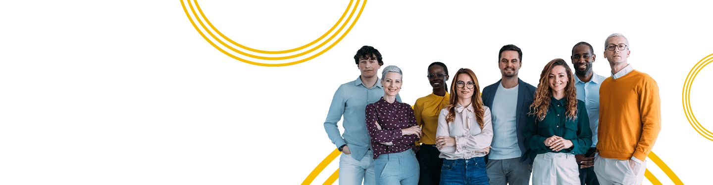 Group of smiling corporate professionals of different ethnicities standing together - symbolizing what could be a RICOH Boulder Customer Experience Center (CEC).