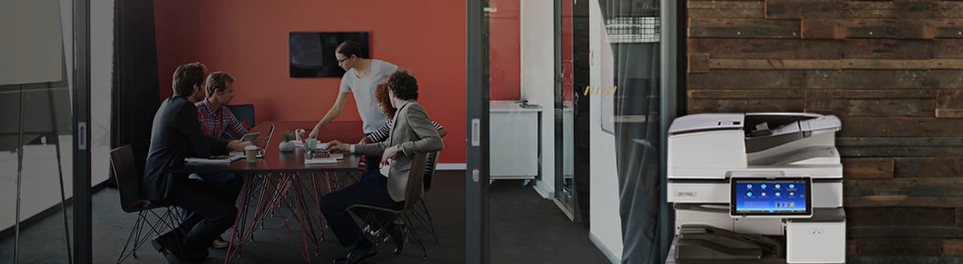 Conference room with people meeting and printer with smart operation panel in front