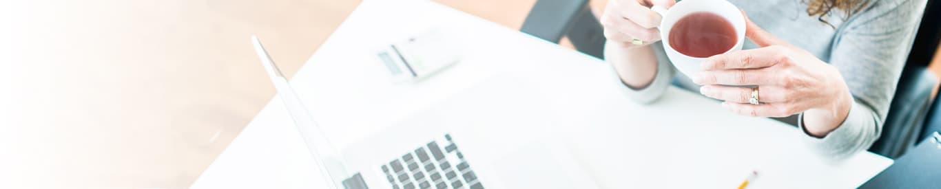 Woman working from home with tea